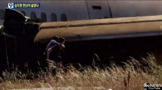 asiana flight attendant carries passengers