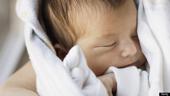 mom holding baby