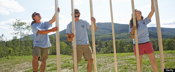 volunteers building a home