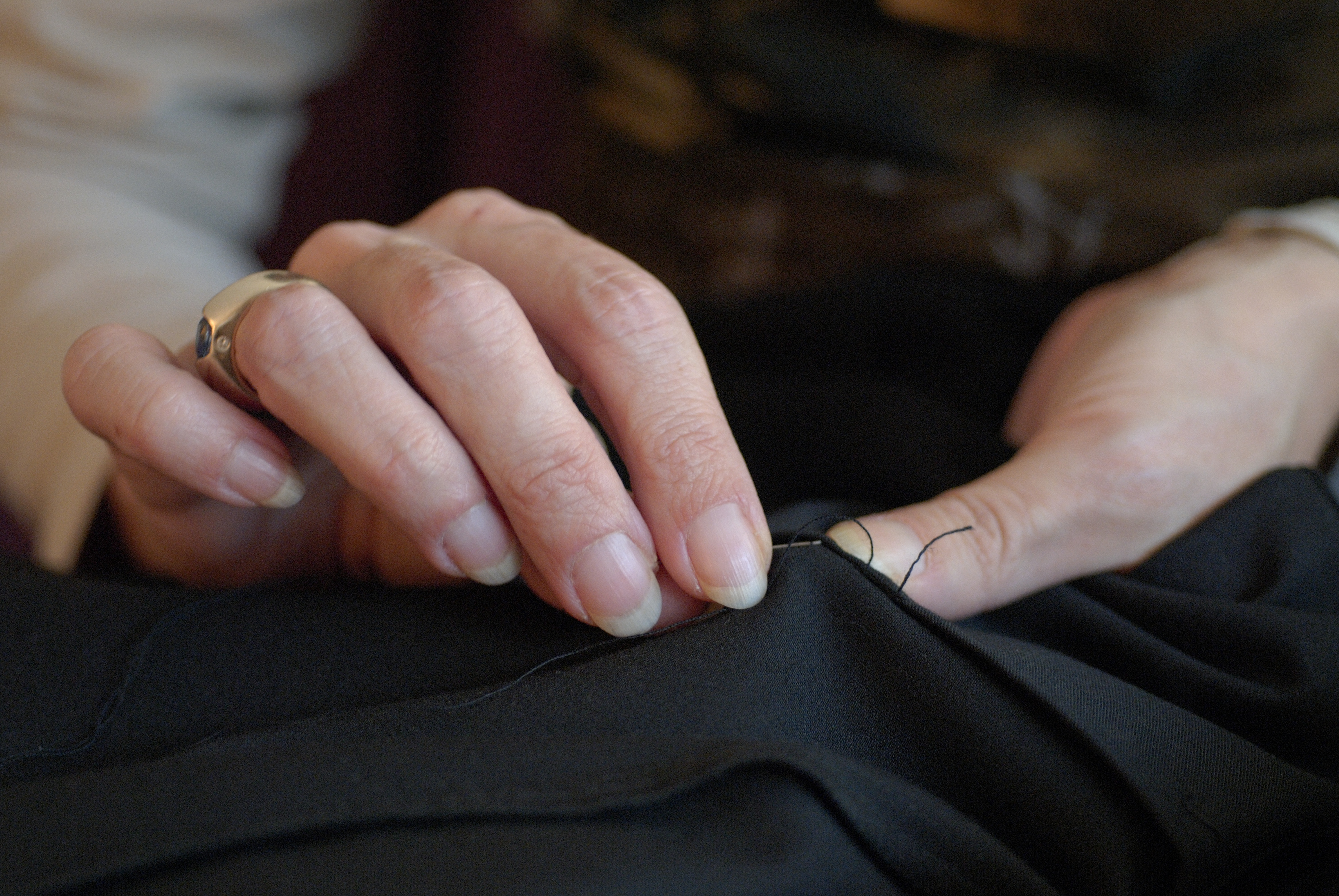 mature woman sewing