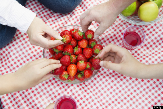 hands reaching for food