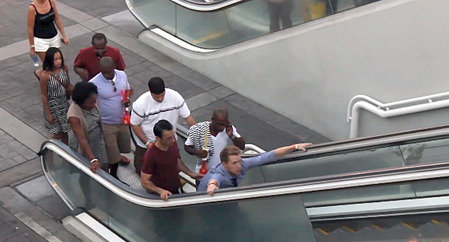 Clown Throwing Pie On Escalator