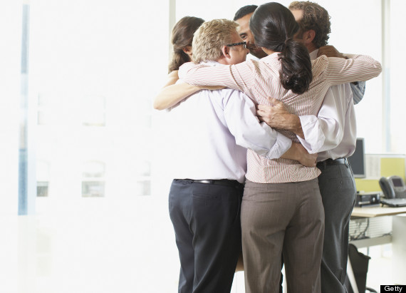 coworkers hugging