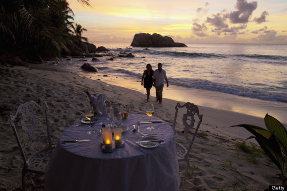 couple holding hands on beach