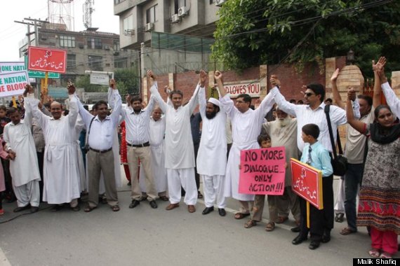 men holding up hands