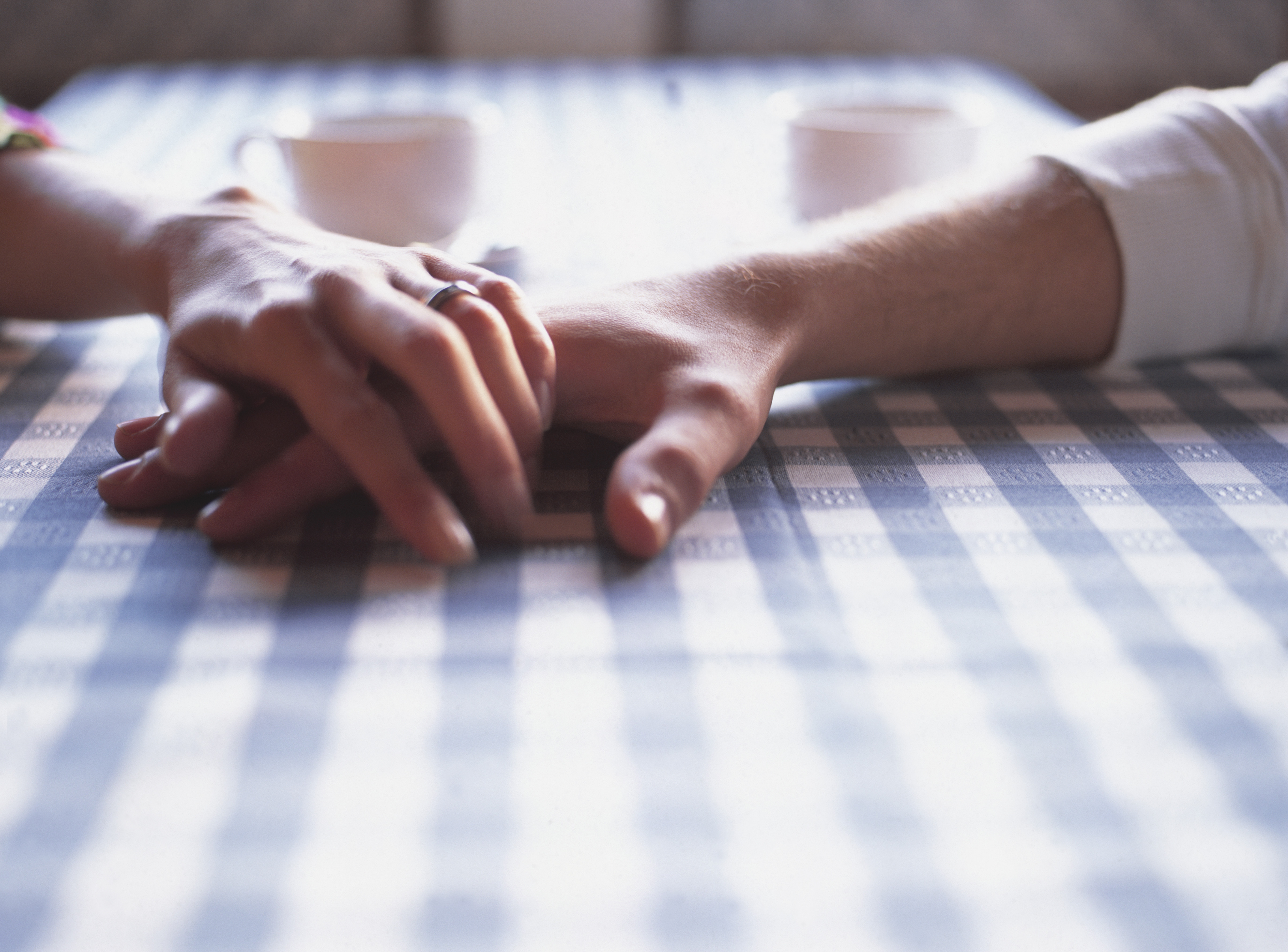 two women holding hands