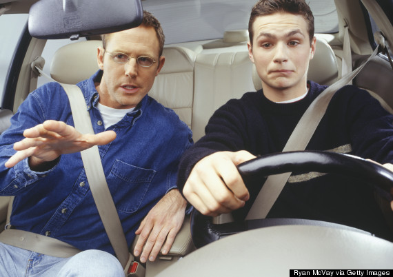 dad teaching son to drive