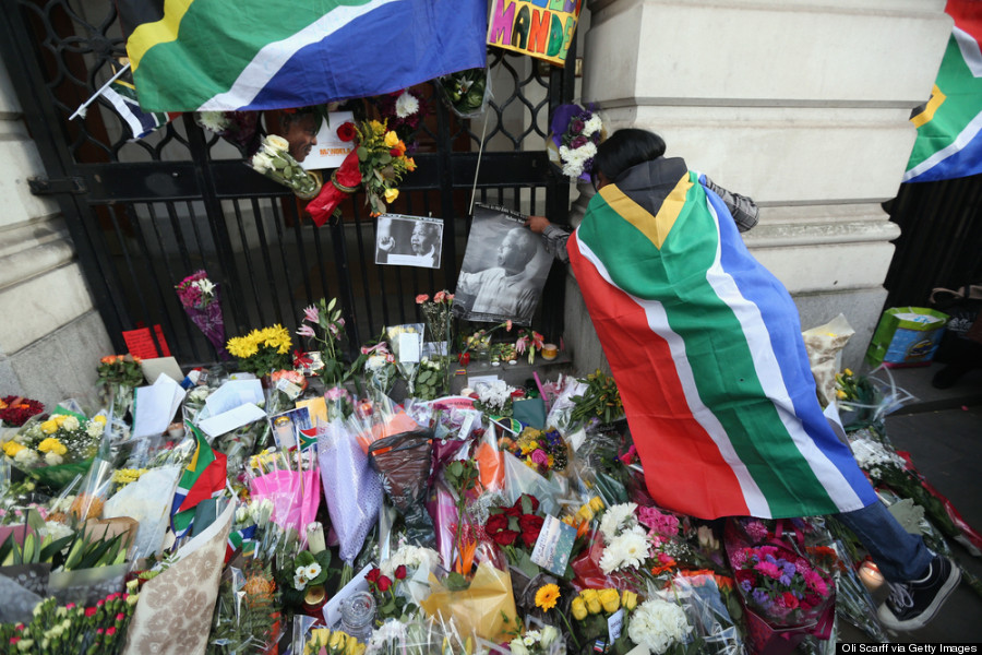 a woman wearing a south african national flag