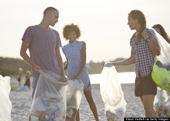 picking up trash on the beach