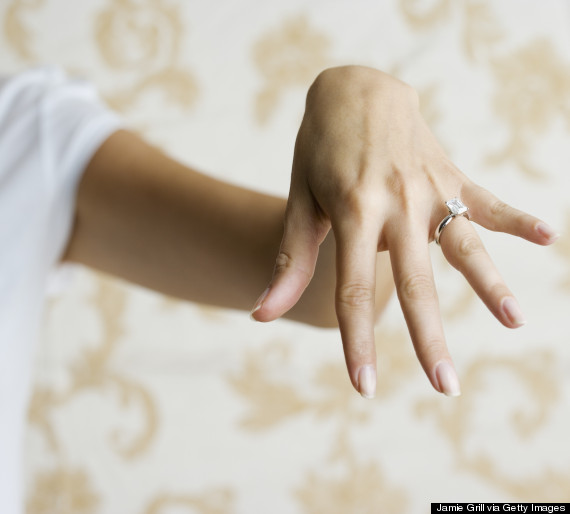 showing engagement ring