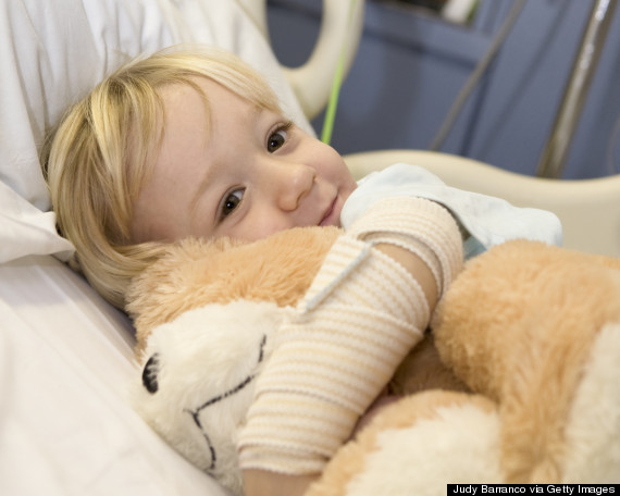 sick child in hospital smiling