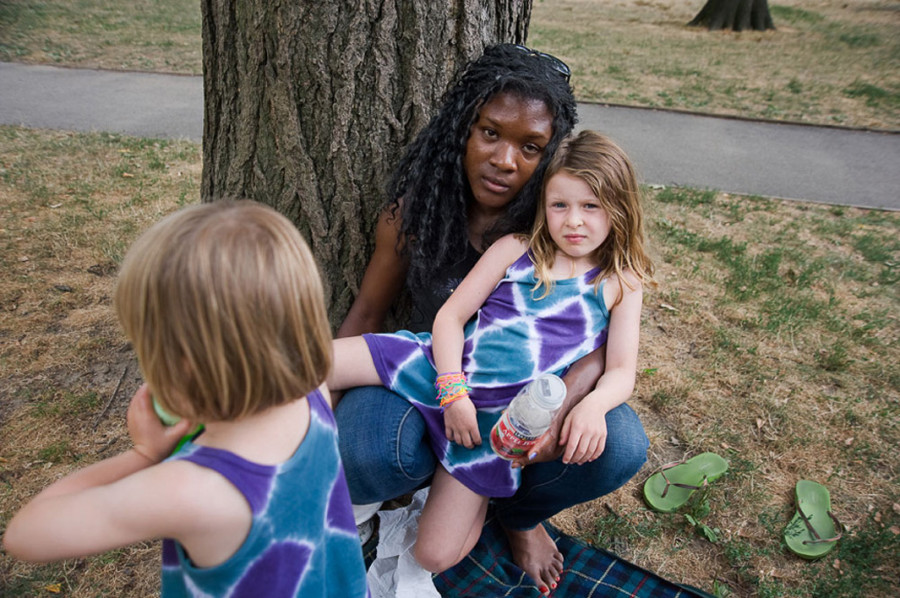 Kim and the sisters: After a picnic in Central Park, Kim plays with two of ...