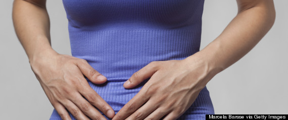 woman holding stomach