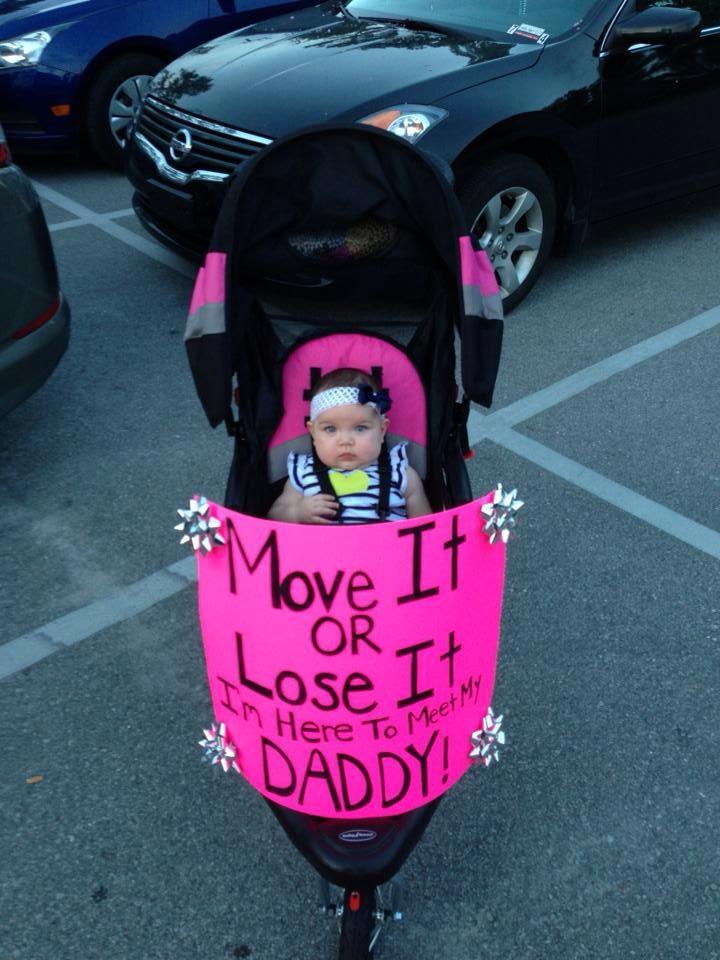 baby with poster