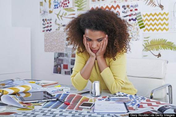 unhappy black woman office