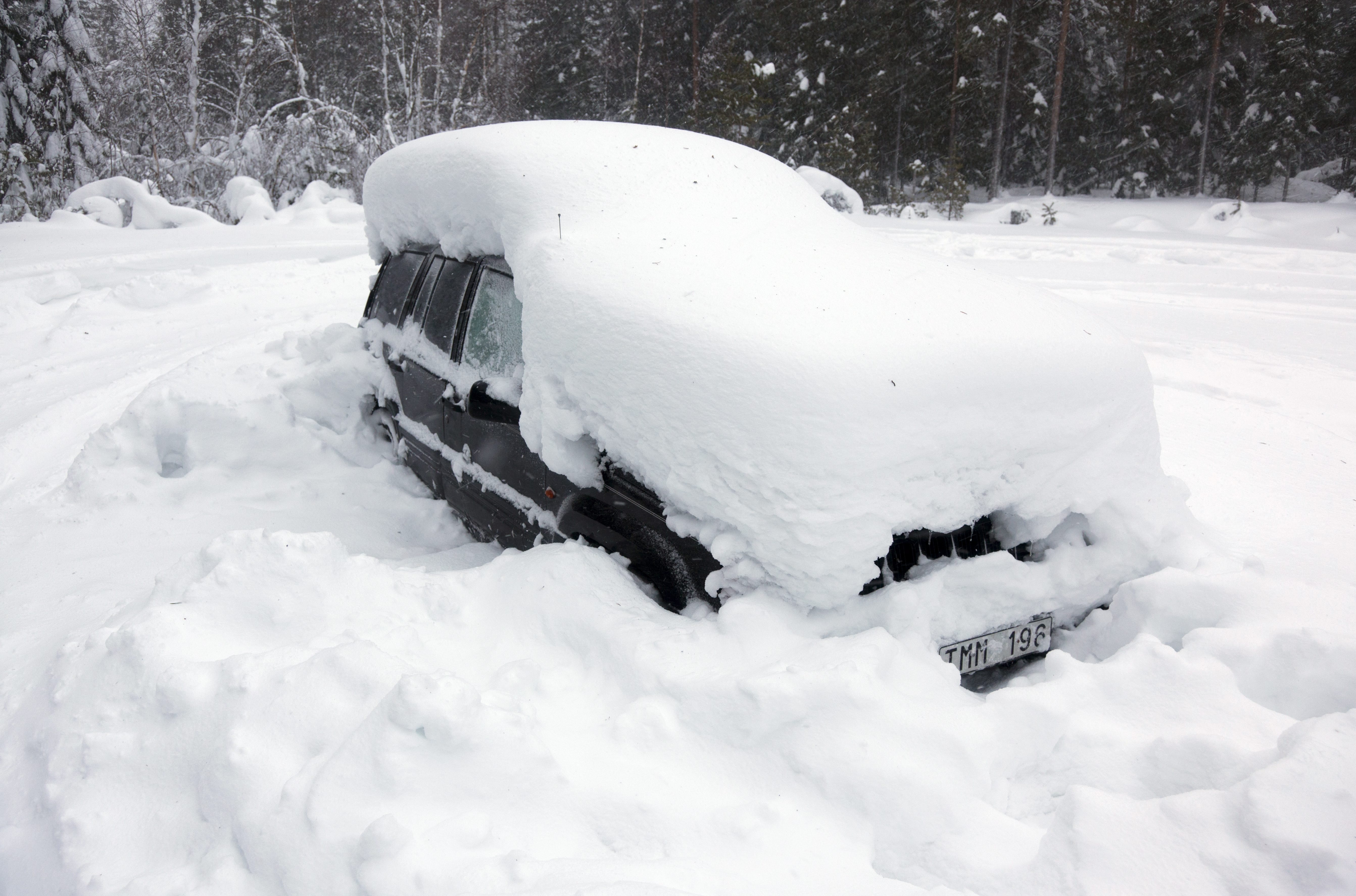 man snow car sweden