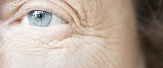 woman looking at her wrinkles