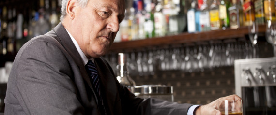 older man sitting alone at bar