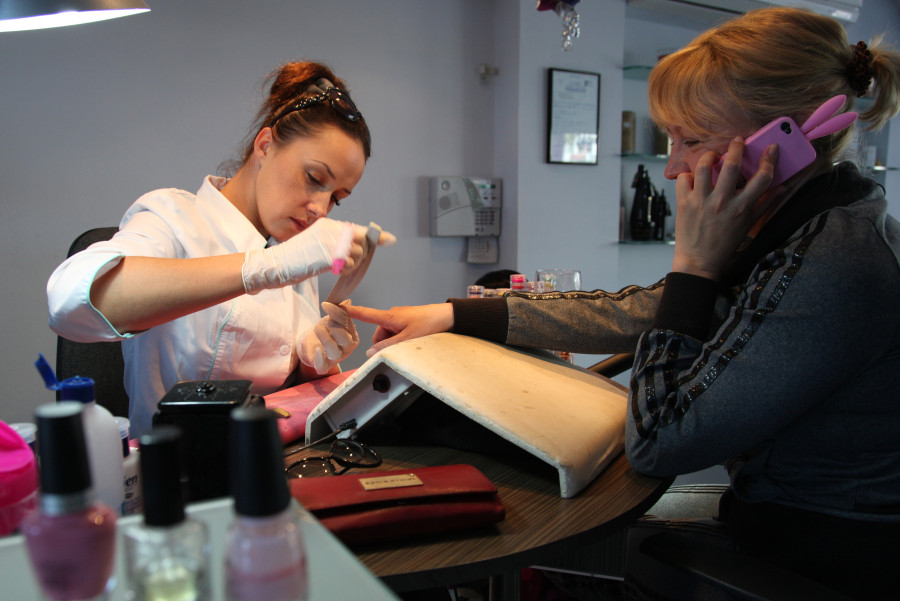 women getting pedicure