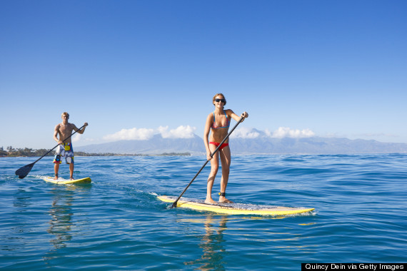 couple stand up paddle