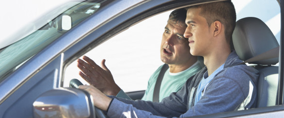 parent teaching teenager to drive