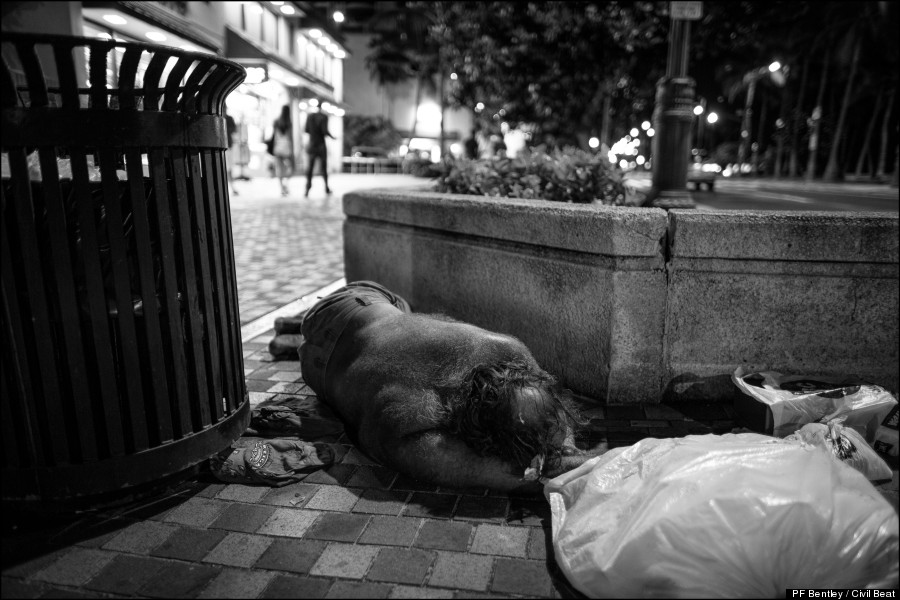 sleeping beside trash