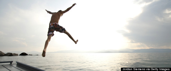 person jumping in water