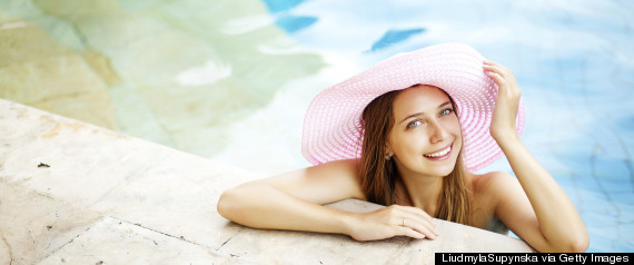 woman touching wet hair pool