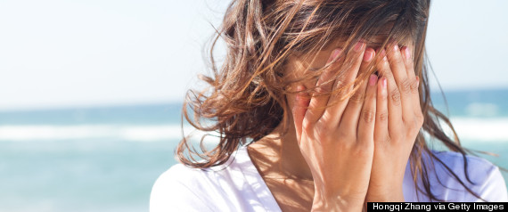 woman sad beach