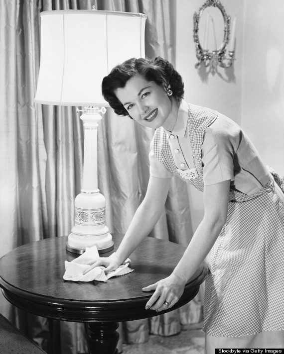 woman cleaning furniture