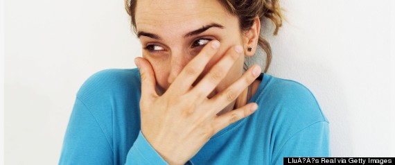 woman covering mouth