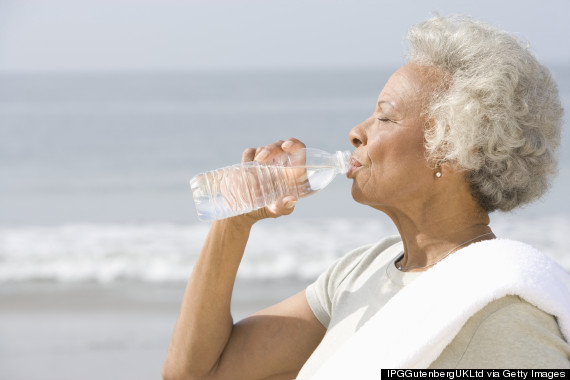 older person drinking water