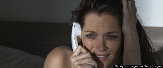 woman on phone scared