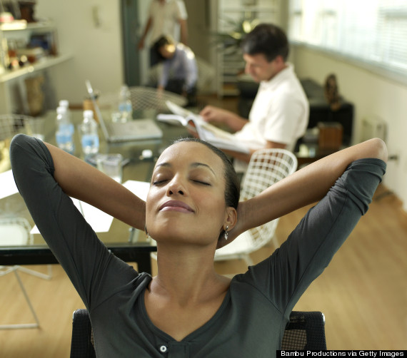 woman stretching desk