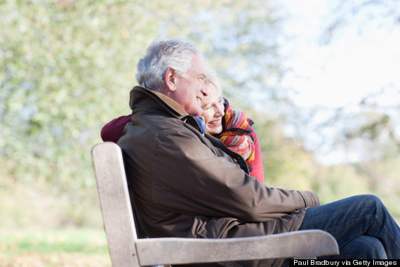 happy older couple on bench