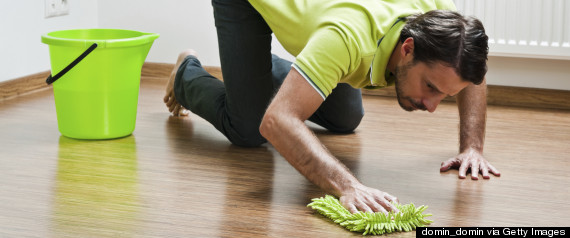 man scrubbing floor