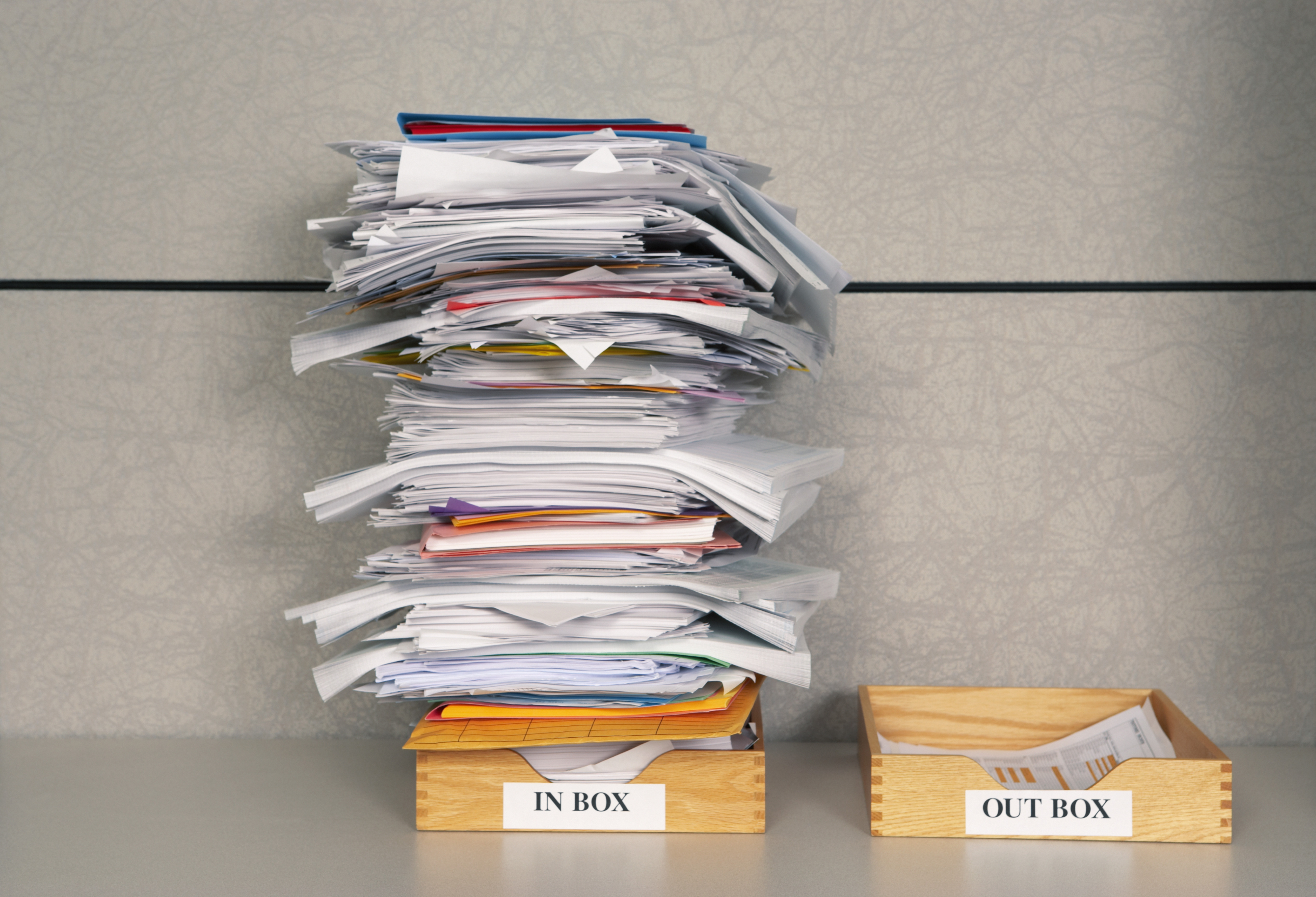 stack of papers on desk