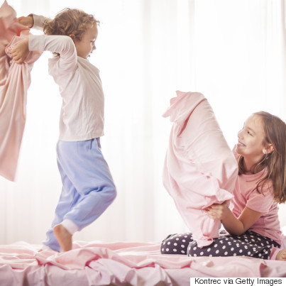 sibling fighting in bed