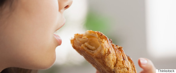 woman eating a pastry