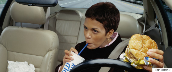 woman eating in car