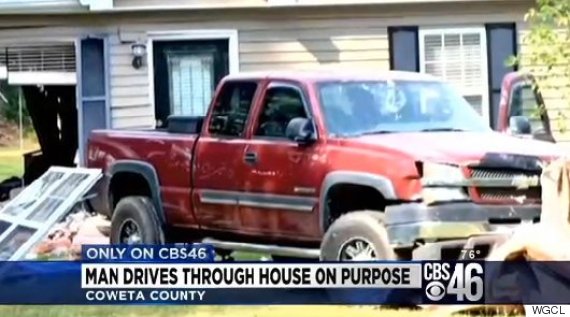 man drives truck house