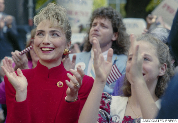 Hillary Rodham Clinton, wife of Democratic presidential hopeful Gov. Bill Clinton of Arkansas, and their daughter Chelsea applaud as the governor announces his intention to run for president, Oct. 3, 1991 in Little Rock. Roger Clinton, Gov. Clinton's brother, is in the background.