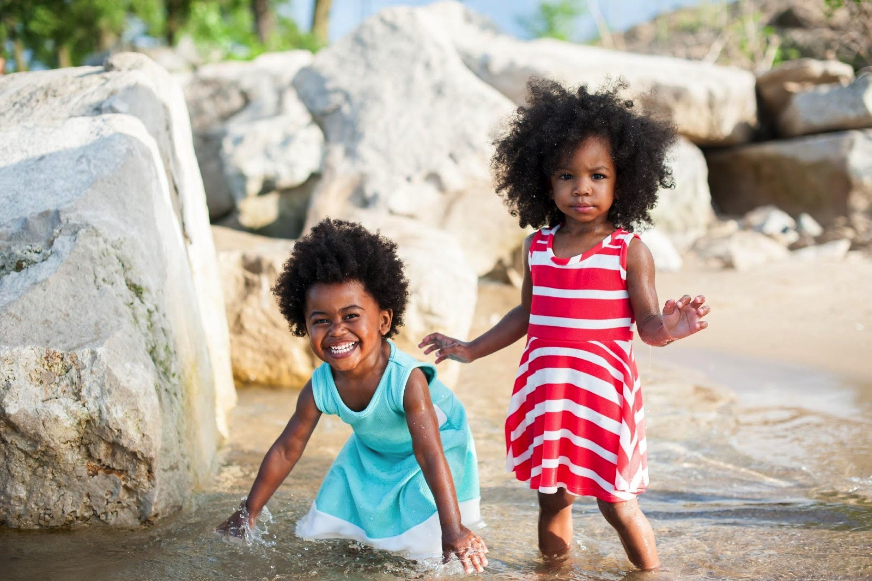little girls playing in water