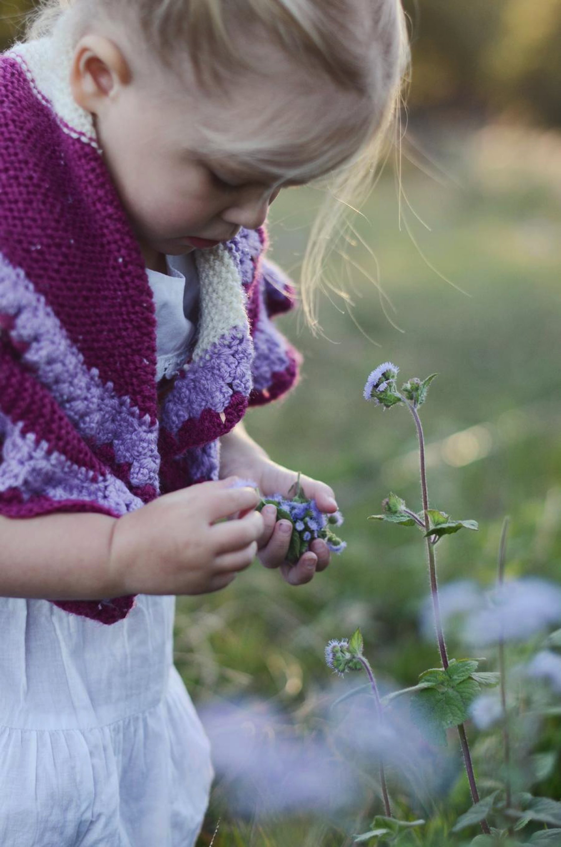 girl holding flower