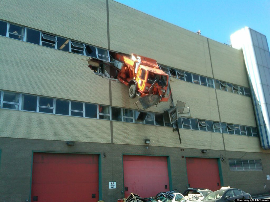 Nyc Sanitation Truck Crashes Through Building Dangles From Third