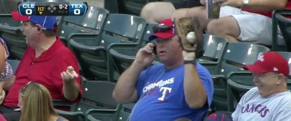 Rangers Fan Catches Foul Ball While On Cell Phone (VIDEO)
