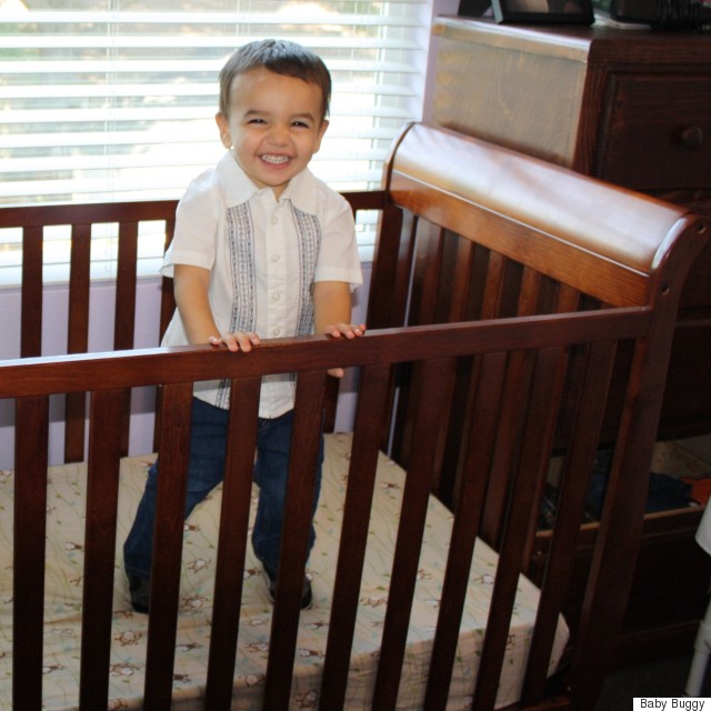 cute boy in crib