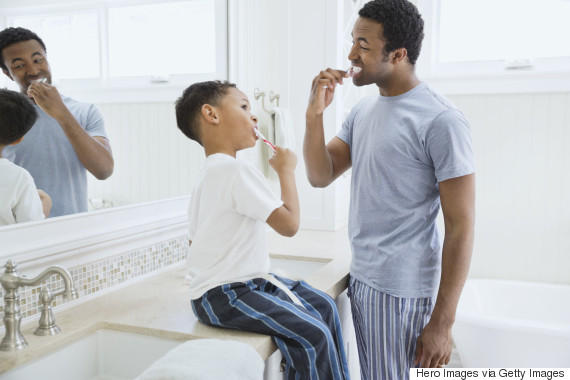 parent child brushing teeth