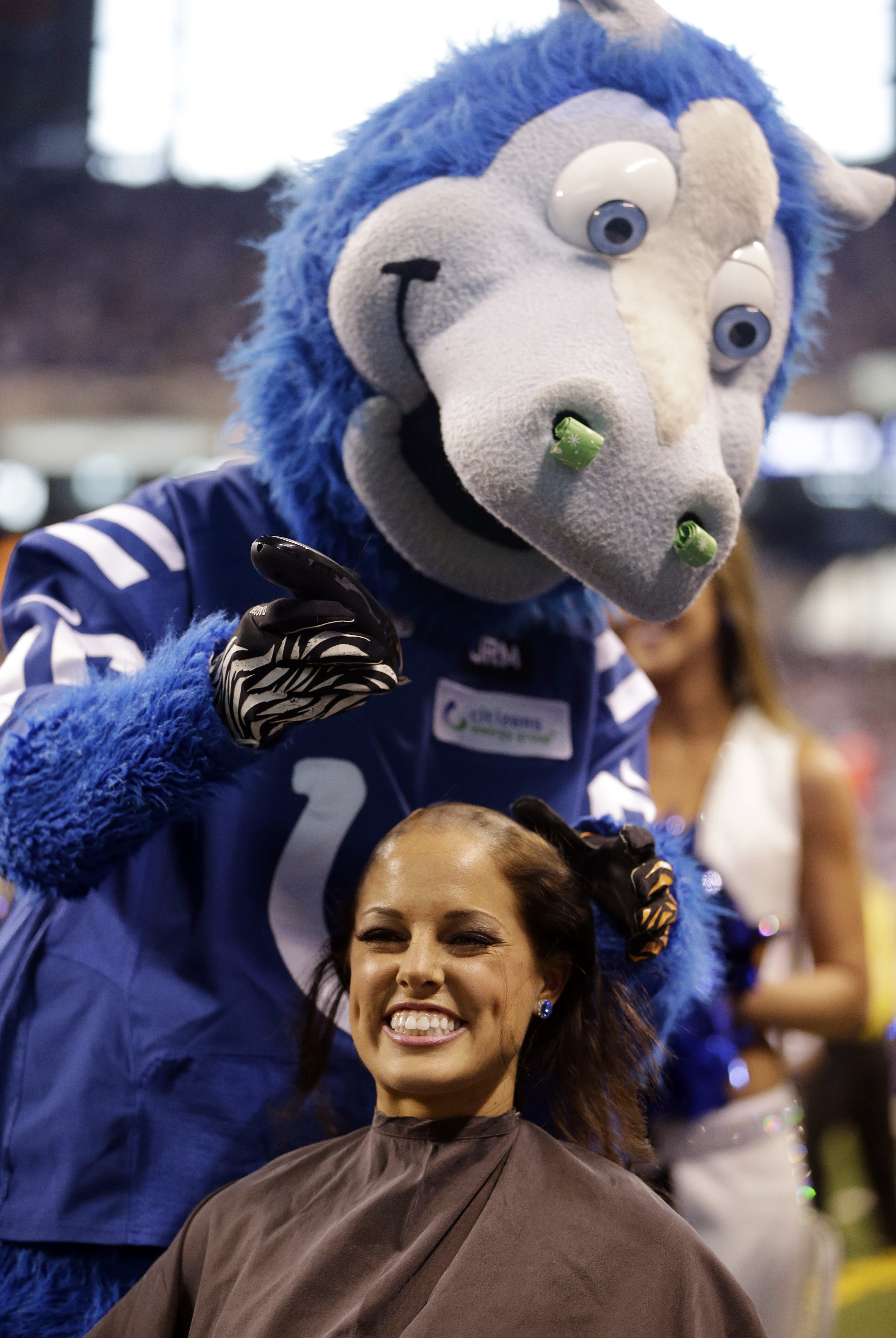 NFL cheerleaders shave heads to support coach