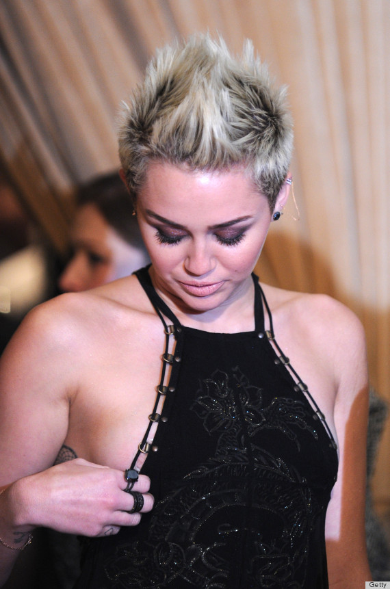 Miley Cyrus Flashes Sideboob, Almost Pops Out Of Dress At Pre